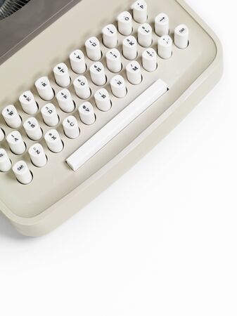 Closeup of a retro typewriter keyboard isolated on white backgroundの写真素材