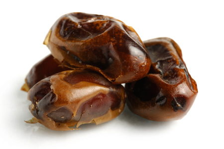 Dried Mazafati dates close-up Isolated over white backgroundの写真素材