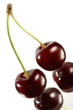 Two cherries close-up Isolated on white backgroundの写真素材