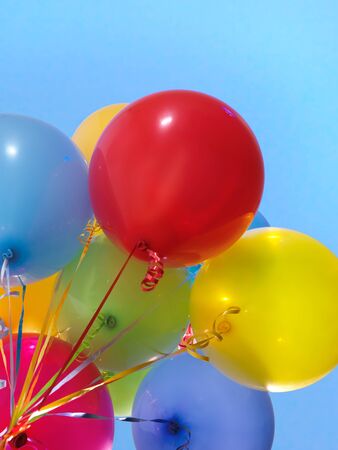 Colorful air balloons over blue sky backgroundの写真素材
