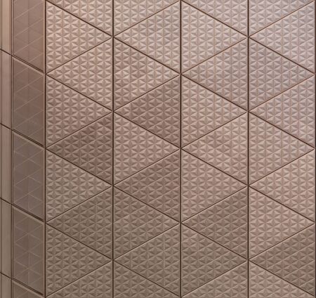 Abstract texture of metal architectural element with triangular pattern