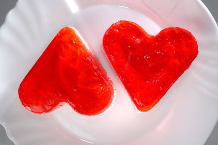 Two heart-shaped appetizing cakes on a plate food still life photography. Love, romantic, Valentines conceptの写真素材