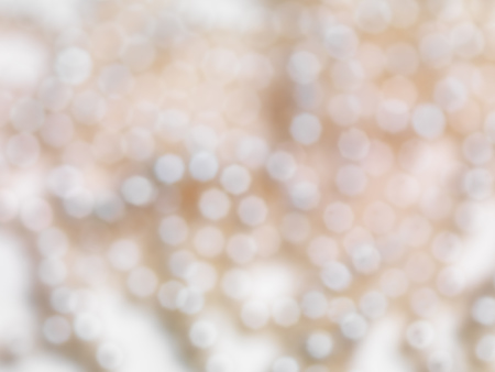 Abstract beige shiny blurred out of focus background textureの写真素材