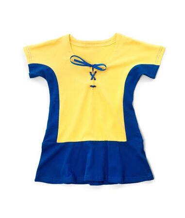 Cute yellow blue childrens dress kids clothes isolated on white backgroundの写真素材