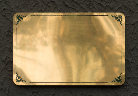 Shiny brass yellow metal sign plate texture isolated with clipping pathの写真素材