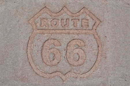 Stone road sign, the highway that crosses the USA from the west coast to the east coast. Abstract rectangular background. Concept for traveling and adventureの写真素材