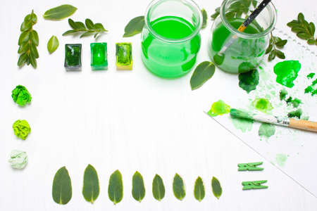 Green leaves draws the artist. Concept art.Ccreative concept, creativity.Workplace, designer...