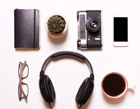 set,collage of men's, women's accessories.Collage of men's, women's accessories on white background. Phone,headphones,camera vintage, notebook, glasses,coffee. Creative concept, creative, human, hipster, designer, photographer.Top view,View  aboveの写真素材