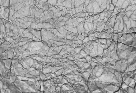 Silver background texture of crumpled paperの写真素材