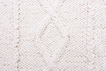 White blue knitted texture with pattern. Wool jersey background