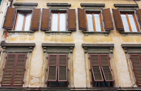 Old house with brown shutters in Florence, Italy (Firenze)の写真素材