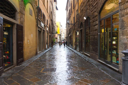 FIRENZE, ITALY - February 06, 2017 - Old street after rain in Florence, Italyのeditorial素材