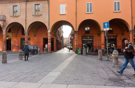 BOLOGNA, ITALY -FEBRUARY 08, 2017:old street with arches ,of Archiginnasio palace , University of...