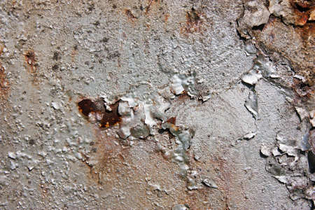 Grunge gray, silver, rusty , metal background with shabby paint in the cracksの写真素材