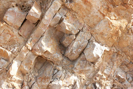 Rough large,brown  natural stone, granite wall, background.seamless texture for design 