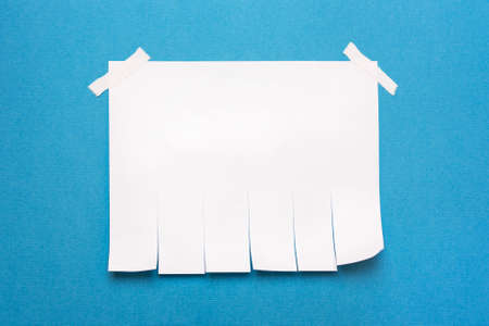 Pure white paper, template, note for writing text on a blue background.The concept of job, search, advertising adsの写真素材