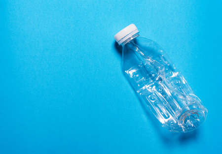 Plastic bottle on a blue background..The concept of sorting polyethylene, household waste.の写真素材