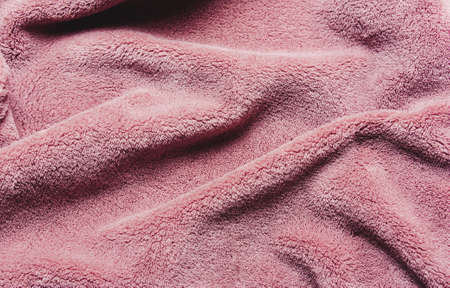 Pink soft fleece texture. The surface of a teddy crumpled microfiber rugの写真素材