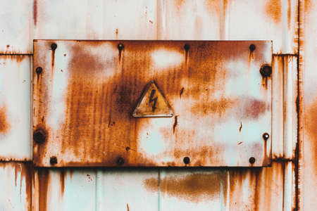 Background yellow old rusty grunge metal, danger signの写真素材