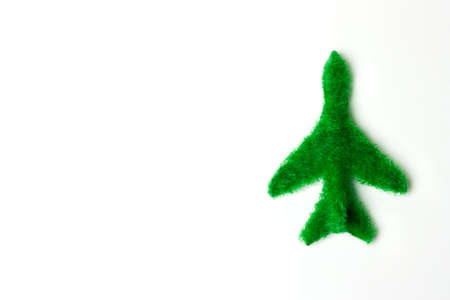 The plane of the grass on a white background. The concept of environmental transport.