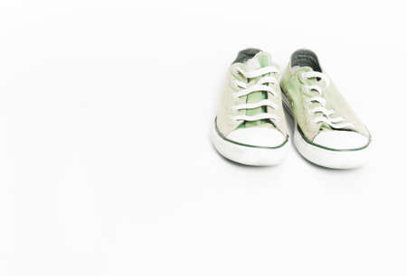 Vintage old green sneakers, shoes. Concept of multiple trips, free life, tourism