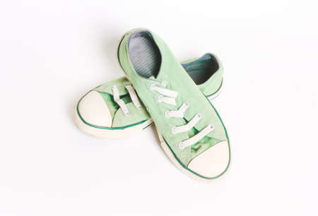 Vintage old green sneakers, shoes. Concept of multiple trips, free life, tourismの写真素材