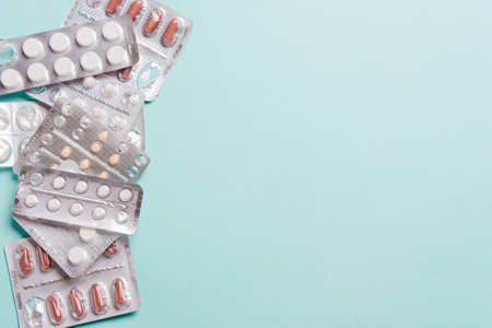 Capsules, pills in blister packs on  blueの写真素材