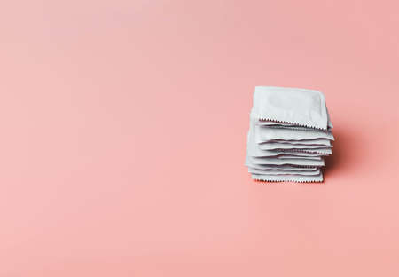 Stack of condom on  pinkの写真素材
