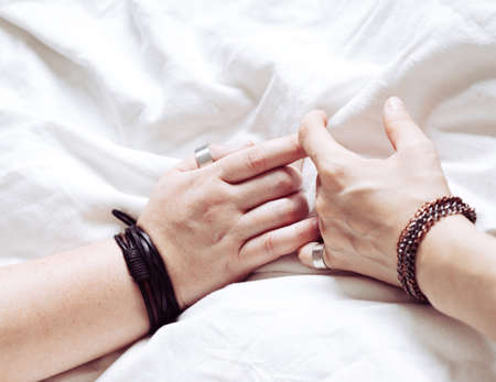 Hands of two women in love, lesbians. LGBT concept of love, passion,の写真素材