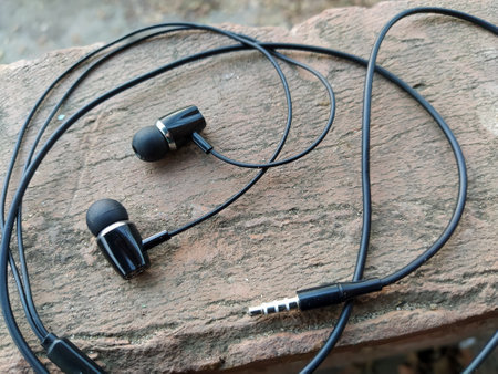 Headphones lie on the brick backgroundの写真素材