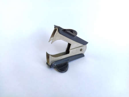 Staple remover on white background isolated macroの写真素材