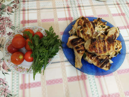Barbeque Chicken and vegetables on the tableの写真素材