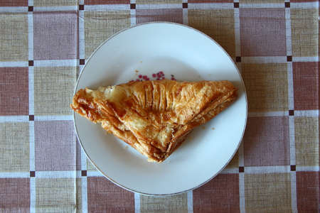 Puff triangular bun on the white plateの写真素材