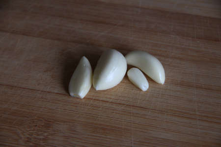 Garlic cloves on the wooden board