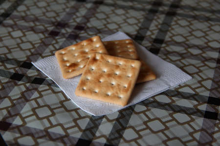 Low calorie biscuits lie on a napkin on the kitchen tableの写真素材