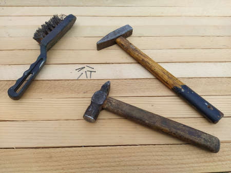 Hammer and tools on the wooden backgroundの写真素材