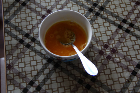 Beaten eggs in a white plateの写真素材