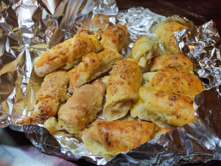 Homemade rolled buns with walnuts wrapped in a foil