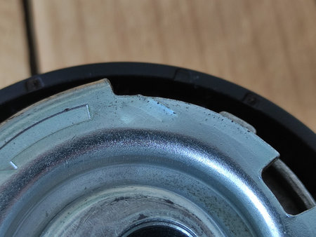 Timing belt roller on wooden background