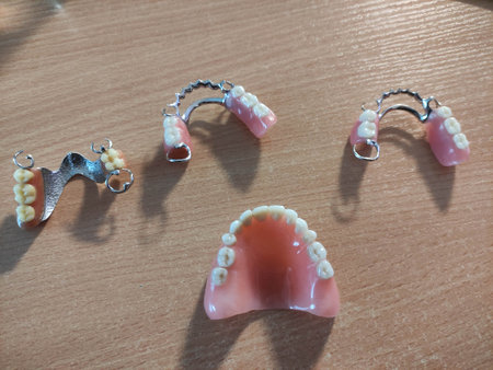 Group of dentures on the table at the dentist in the dental office