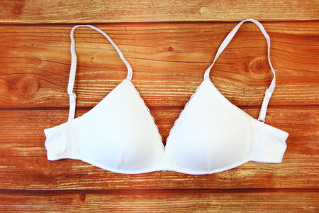 White bra on wooden backgroundの写真素材