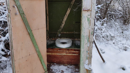 Approaching an old wooden village toilet and interiorの写真素材
