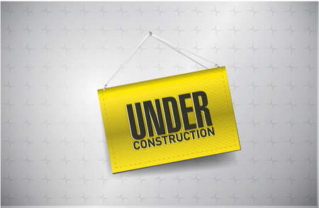 under construction sign hung on a textured backgroundの写真素材