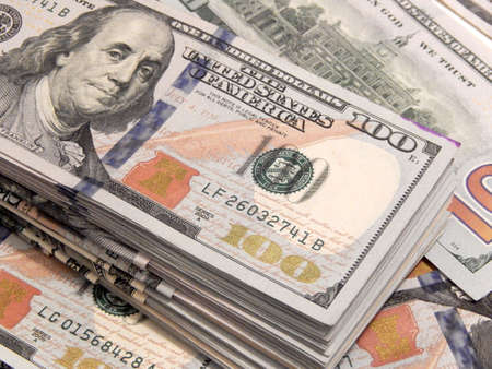 Stack of one hundred dollar bills close-up