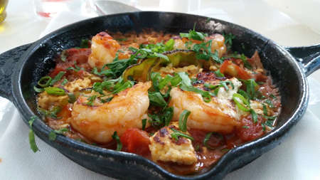 closeup of shrimps on pan with herbs.の写真素材