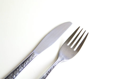 Knife and fork isolated on white backgroundの写真素材