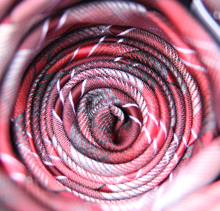 Red and White Striped Tie Isolated on White Background.の写真素材