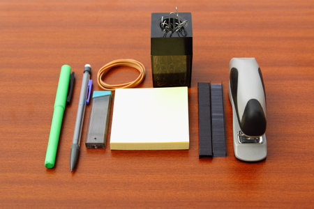 office desk and tools over a brown table background
