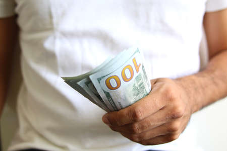 Man Displaying a Spread of Cash. Business success concept