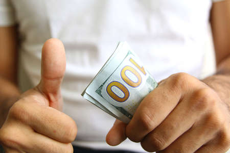 Winner showing profits. spread of cash. currencyの写真素材